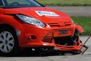 A red car after a crash test. A stock market crash is just as abrupt.
