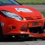 A red car after a crash test. A stock market crash is just as abrupt.