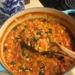 Moroccan Butternut, Chickpea, and Couscous Stew made in a light blue Le Creuset dutch oven.