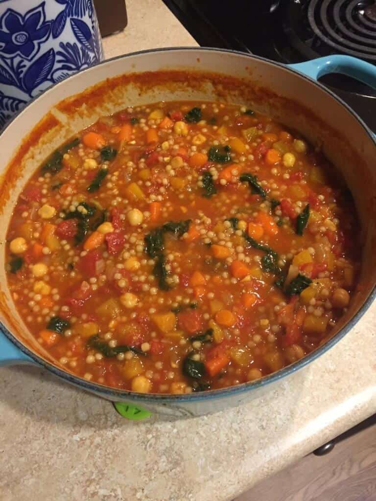 Moroccan Butternut, Chickpea, and Couscous Stew made in a light blue Le Creuset dutch oven.