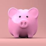 savings and frugality shown with a pink piggy bank