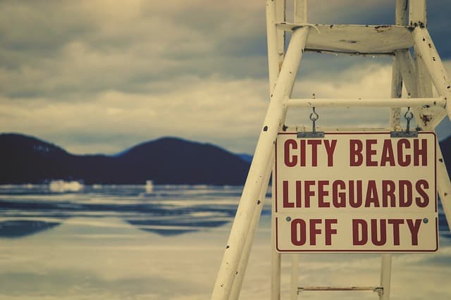 A sign at the beach says 