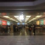 A photograph taken by an iPhone of a busy Apple storefront. Taken by Trey Henninger for used in articles about Apple stock.